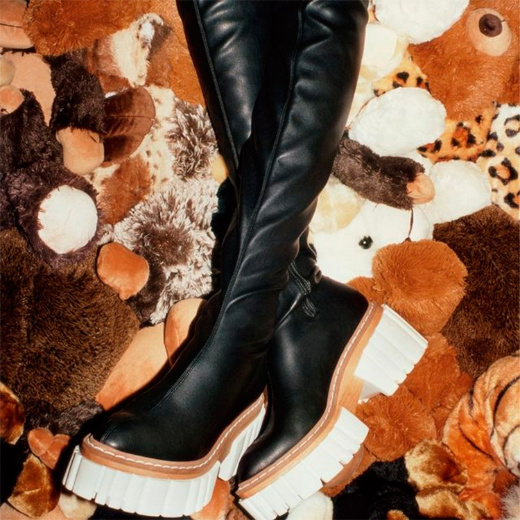 High black vegan boots from Stella McCartney with a lot of teddy bears
